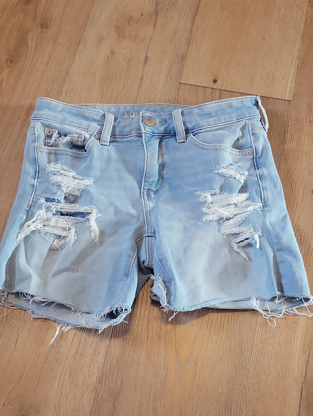 Light Blue Distressed Denim Shorts by
